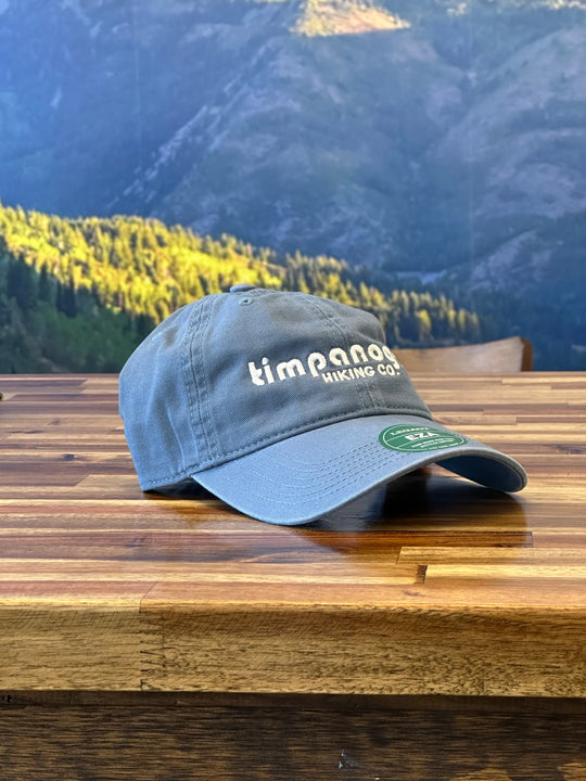 Casual Heather Slate hat with white embroidered Timpanogos logo, ideal for keeping cool and comfortable during your outdoor adventures