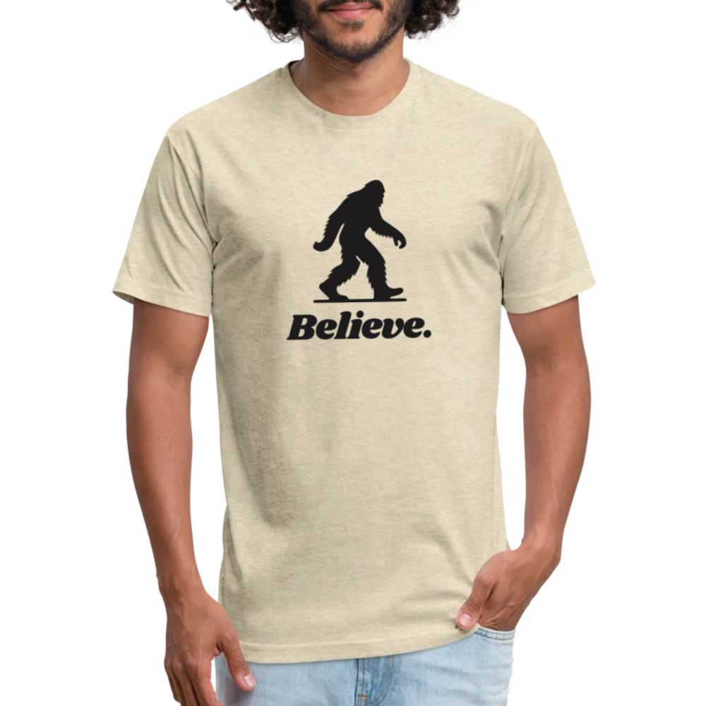 Man wearing a natural cream “Believe” Sasquatch t-shirt from Timpanogos Hiking Co., unisex cryptid-themed graphic tee for outdoor enthusiasts and Bigfoot believers.