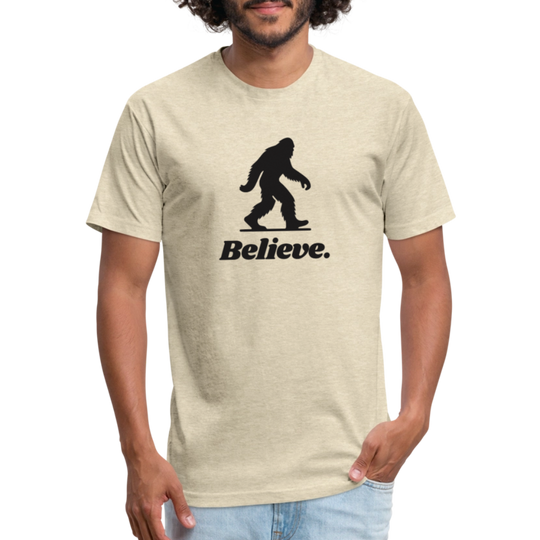 Man wearing a natural cream “Believe” Sasquatch t-shirt from Timpanogos Hiking Co., unisex cryptid-themed graphic tee for outdoor enthusiasts and Bigfoot believers.