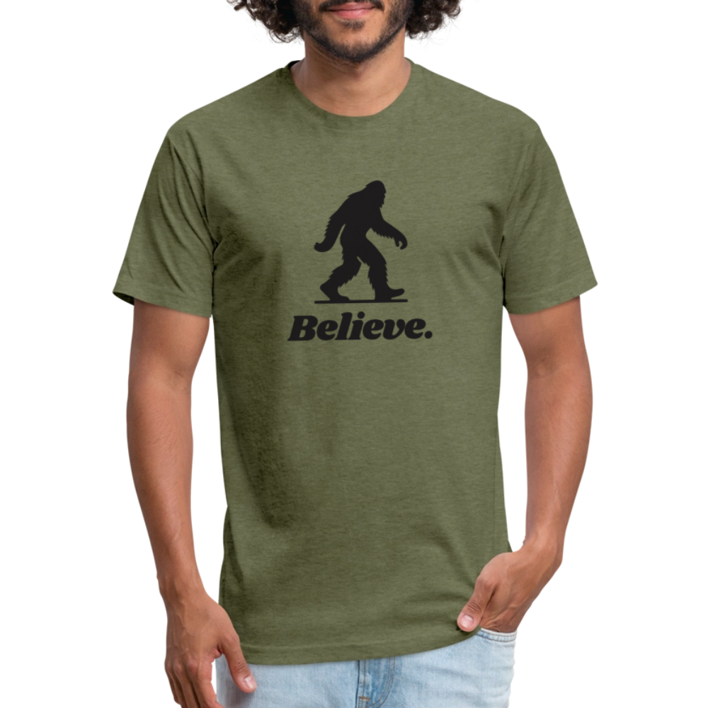 Man wearing a heather olive green “Believe” Sasquatch t-shirt from Timpanogos Hiking Co., unisex graphic tee for cryptid lovers, hikers, and believers in the unexplained.