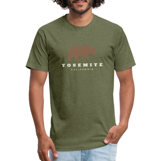 Man wearing a Heather Military Green t-shirt with a Yosemite bear design, accompanied by "Yosemite California" text, standing casually with his hands in his pockets.