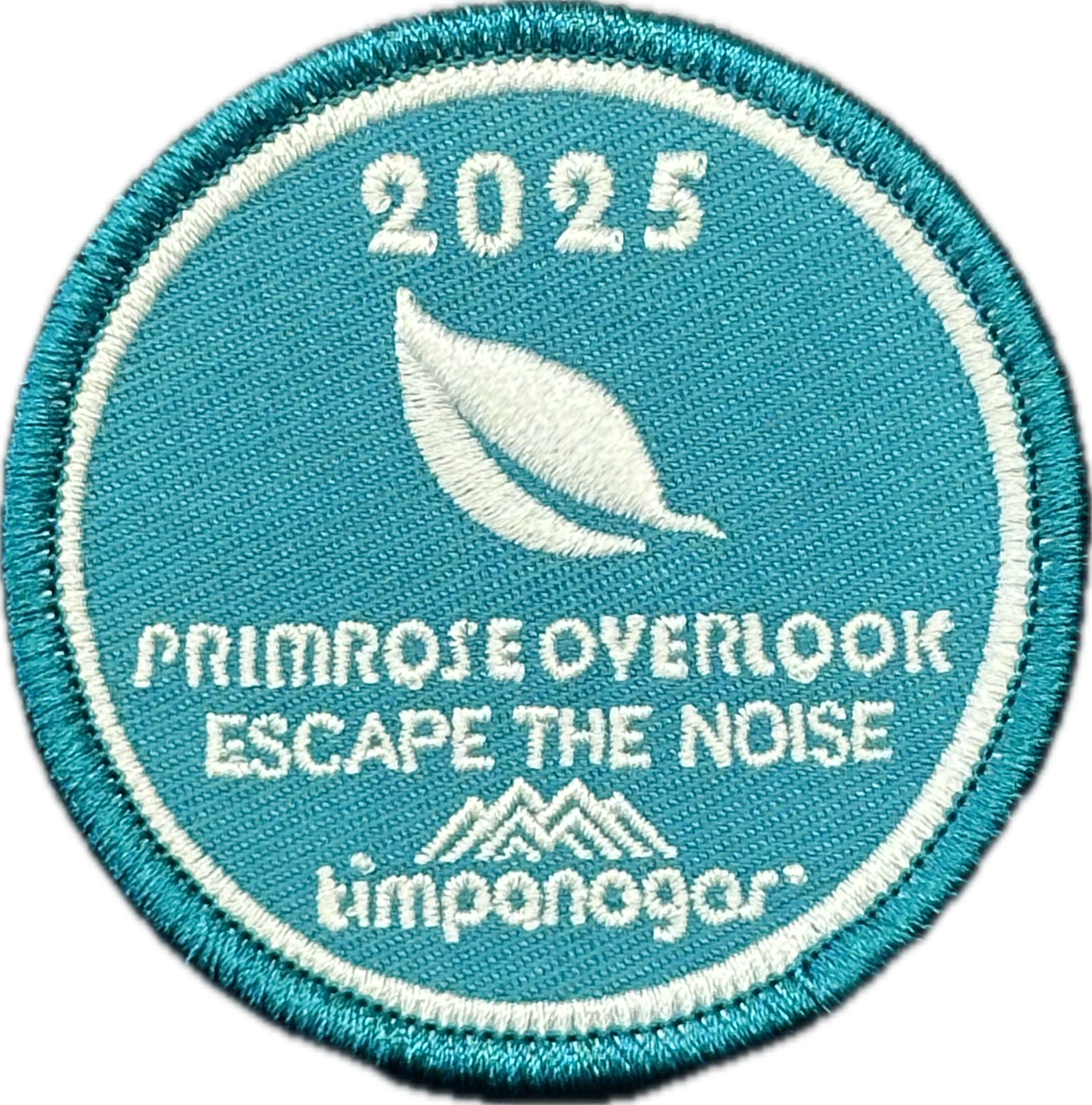 2025 Timpanogos "Primrose Overlook" patch in sky blue with white embroidery. Features a single leaf graphic above the phrase "Escape the Noise" and the Timpanogos Hiking Co. logo stitched at the bottom.