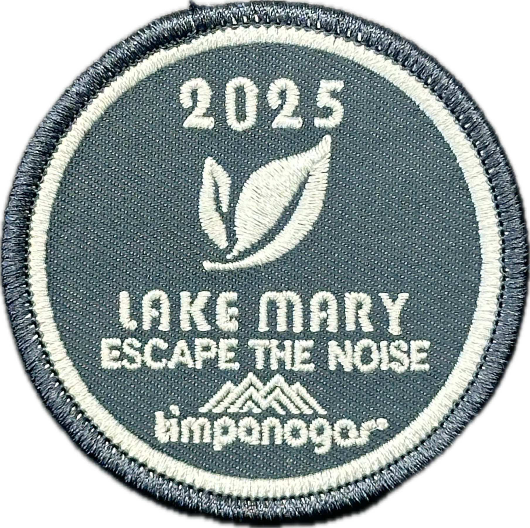 2025 Timpanogos "Lake Mary" patch in slate blue with white embroidery. Features a double leaf graphic, the phrase "Escape the Noise," and the Timpanogos Hiking Co. logo beneath.