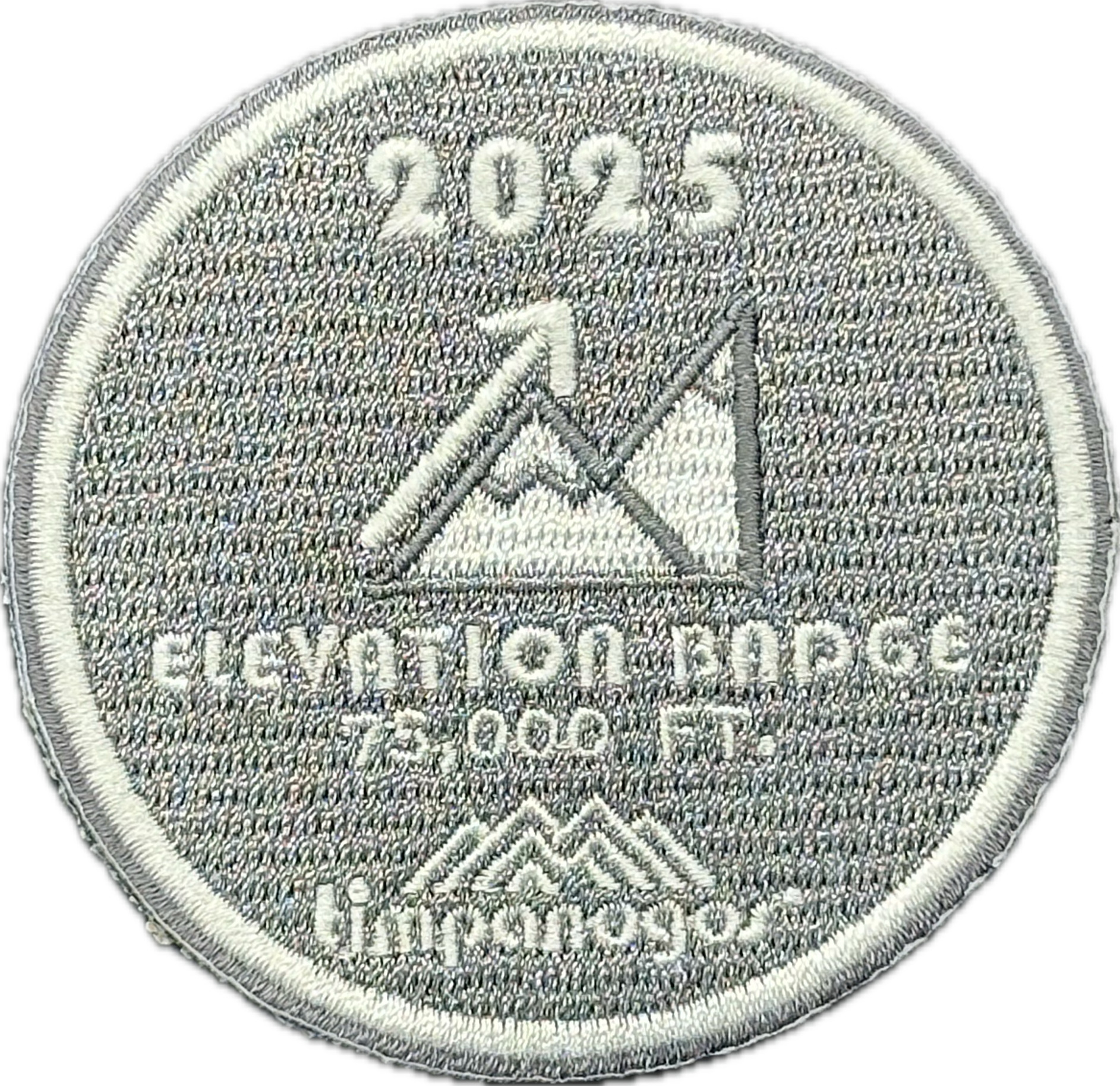 2025 Timpanogos Elevation Badge patch in silver gray with white embroidered text and design, awarded for reaching 75,000 feet of elevation gain. Features a stylized mountain graphic with an upward arrow and the Timpanogos Hiking Co. logo.