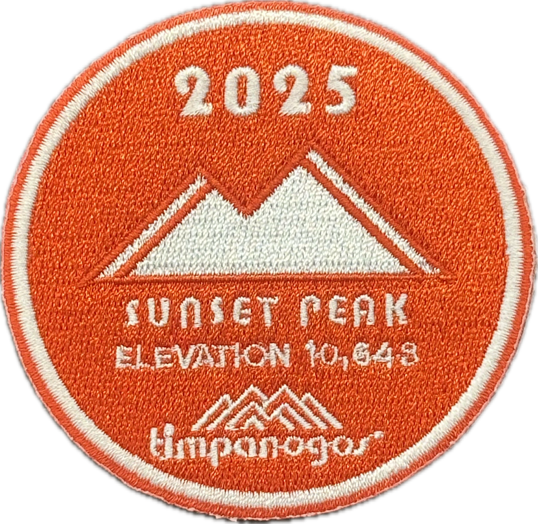 2025 Timpanogos "Sunset Peak" patch in orange and white, featuring the mountain design with "Sunset Peak" at an elevation of 10,643 feet, with the Timpanogos Hiking Co. logo at the bottom.