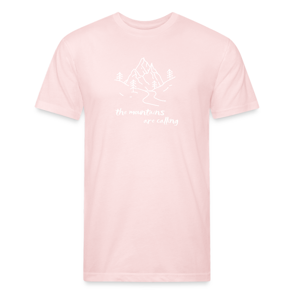 blush pink t-shirt featuring a hand-drawn mountain scene with the phrase "the mountains are calling" in white, perfect for outdoor adventurers and nature lovers

