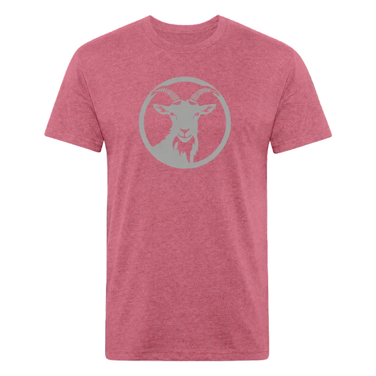 A heather pink crewneck t-shirt featuring a light gray circular graphic of a goat head on the chest, displayed against a solid black background.